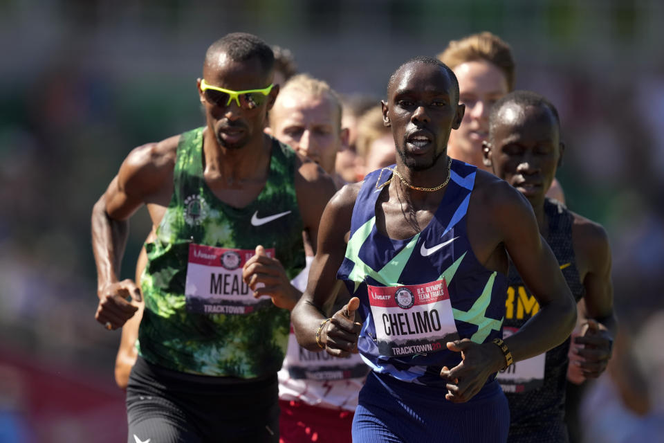 Winner, Paul Chelimo leads the pack in the finals of men's 5000-meter run at the U.S. Olympic Track and Field Trials Sunday, June 27, 2021, in Eugene, Ore. (AP Photo/Charlie Riedel)