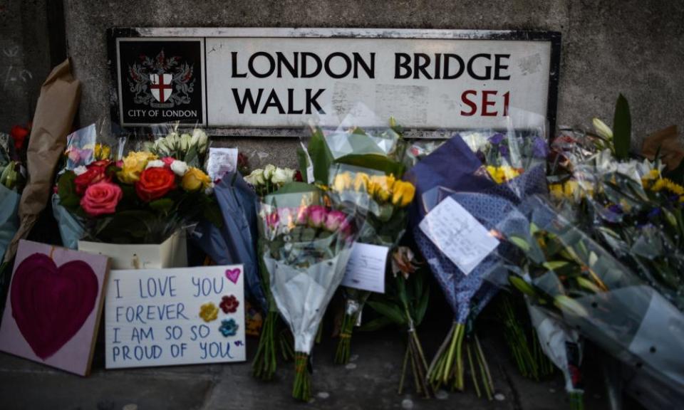 Floral tributes are left for Jack Merritt and Saskia Jones, who were killed in the terror attack.