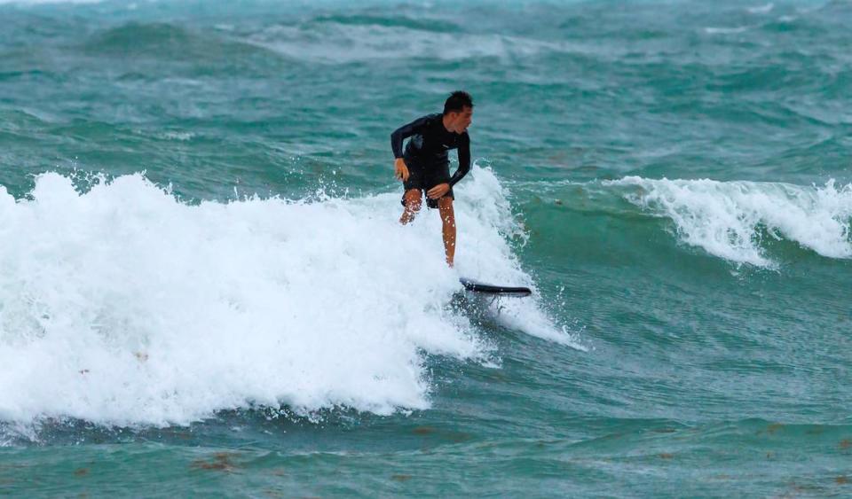 A surfer takes advantage of the waves at the Bal Harbour Lighthouse on Wednesday, April 12, 2023 in Bal Harbour, Florida. Rip current risk remains in effect through until Thursday evening Source:National Weather Service.