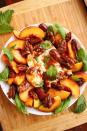 <p>We changed up the <a href="https://www.delish.com/cooking/recipe-ideas/a19695744/easy-caprese-salad-recipe/" rel="nofollow noopener" target="_blank" data-ylk="slk:classic Caprese salad;elm:context_link;itc:0;sec:content-canvas" class="link ">classic Caprese salad</a> by switching out juicy tomatoes for plump summer peaches and replacing sliced fresh mozzarella with its creamier cousin, burrata. Surrounded by fragrant basil then topped with <a href="https://www.delish.com/cooking/recipe-ideas/a34099585/candied-pecans-recipe/" rel="nofollow noopener" target="_blank" data-ylk="slk:candied pecans;elm:context_link;itc:0;sec:content-canvas" class="link ">candied pecans</a> and a drizzle of spicy honey, this sweet & savory salad is a STUNNER.</p><p>Get the <strong><a href="https://www.delish.com/cooking/recipe-ideas/a33472464/peach-and-burrata-caprese-recipe/" rel="nofollow noopener" target="_blank" data-ylk="slk:Peach & Burrata Caprese recipe;elm:context_link;itc:0;sec:content-canvas" class="link ">Peach & Burrata Caprese recipe</a></strong>.</p>