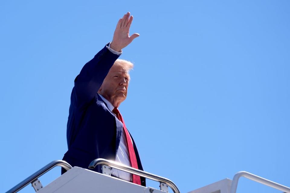 Donald Trump waves as he boards a plane at Harry Reid International Airport after a campaign tripin Las Vegas on Saturday Sep 14, 2014 (AP Photo/Alex Brandon)