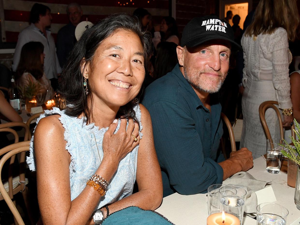 Laura Louie (L) and Woody Harrelson attend Apollo in the Hamptons 2019: Hosted by Ronald O. Perelman at The Creeks on August 03, 2019 in East Hampton, New York