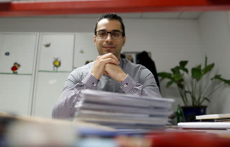 Mo Garfani, 30, from Iran, poses during his apprenticeship for a clerk at the chamber of handicrafts in Dortmund, Germany, October 9, 2015. Picture taken October 9, 2015. REUTERS/Ina Fassbender