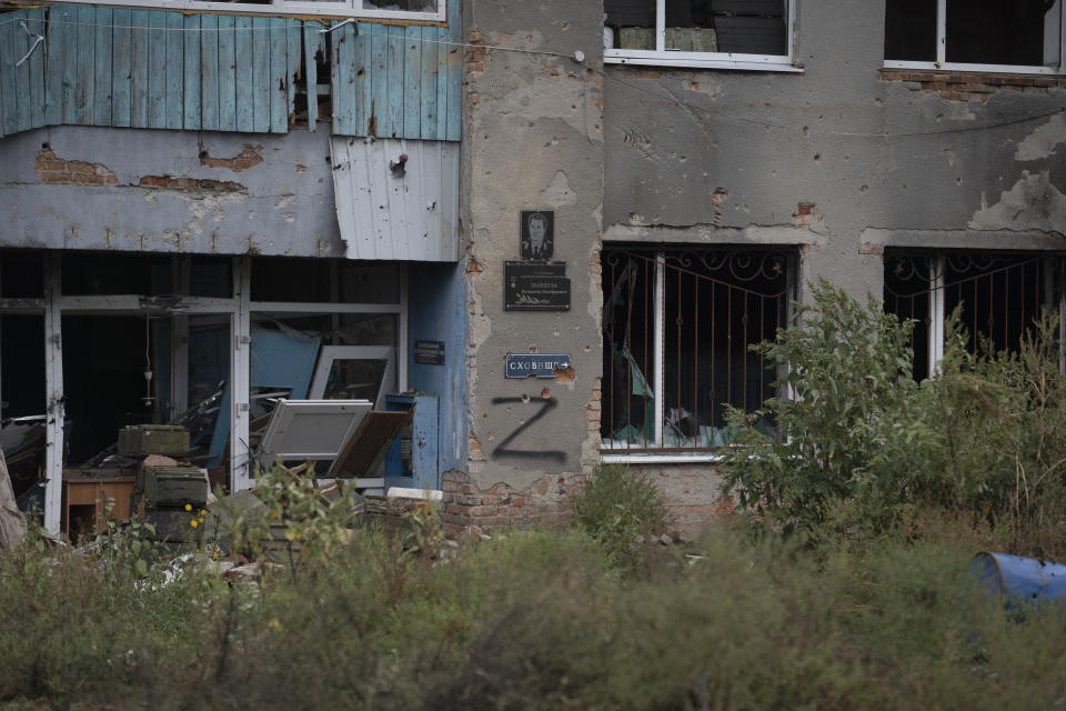 The letter Z, which has become the Russian emblem for the war, is seen on a damaged building that was occupied by Russian soldiers in the freed village of Hrakove, Ukraine, Tuesday, Sept. 13, 2022. Russian troops occupied this small village southeast of Ukraine’s second largest city of Kharkiv for six months before suddenly abandoning it around Sept. 9 as Ukrainian forces advanced in a lightning-swift counteroffensive that swept southward. (AP Photo/Leo Correa)