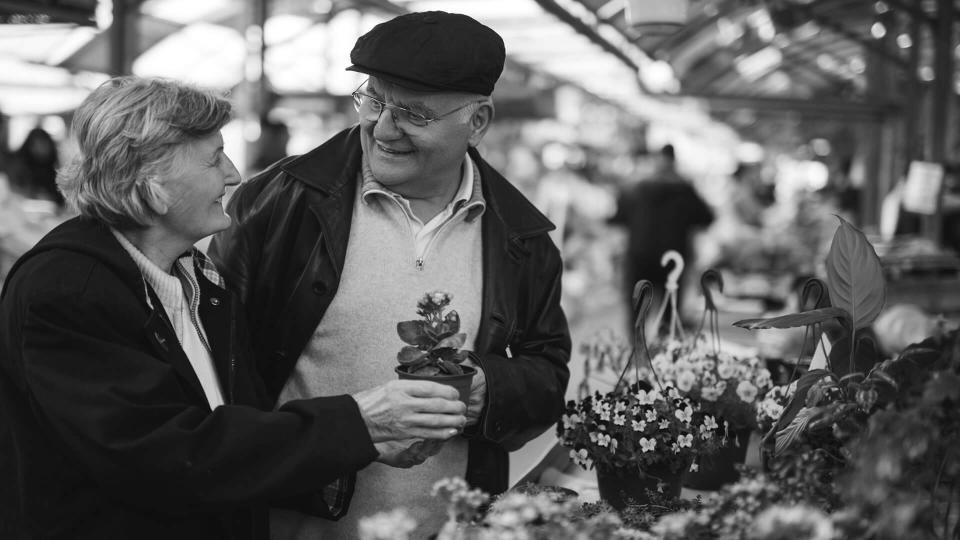 elderly couple shopping for flowers