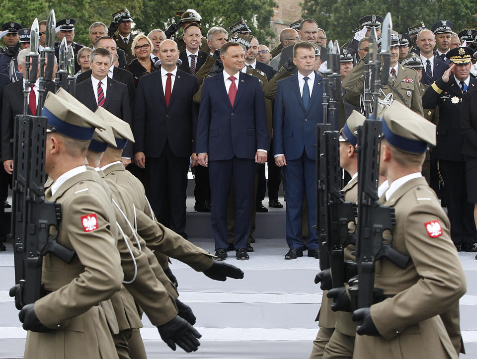 Poland's President Andrzej Duda attends the Polish National Army Day parade in Warsaw, Poland, Wednesday, Aug. 15, 2018.Poland's president voiced hope for a permanent U.S. military presence in his country as the country put on a large military parade on its Army Day .(AP Photo/Czarek Sokolowski)