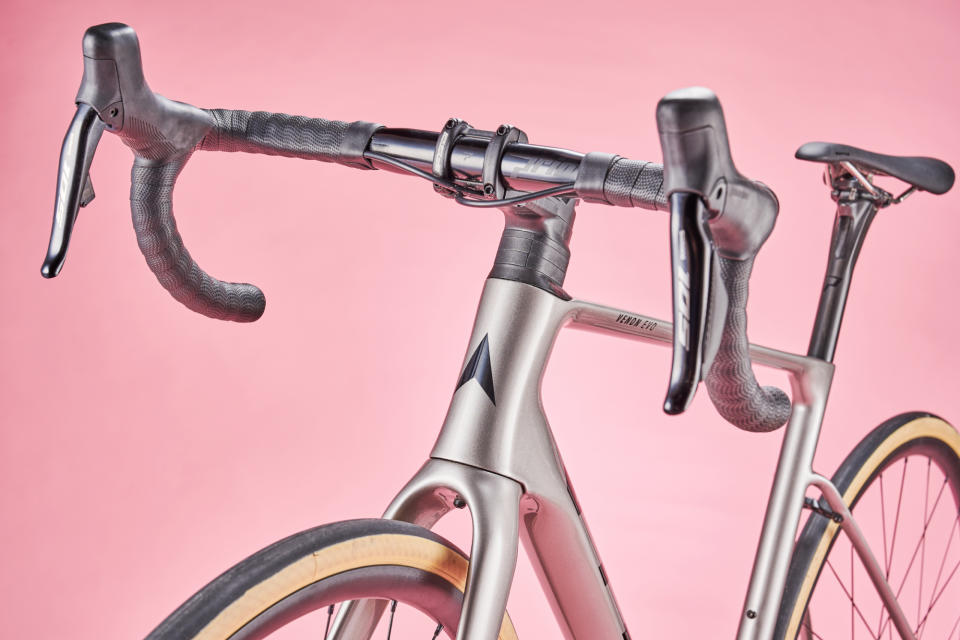 Vitus Venon Evo-RS 105 Di2 road bike on a pink background