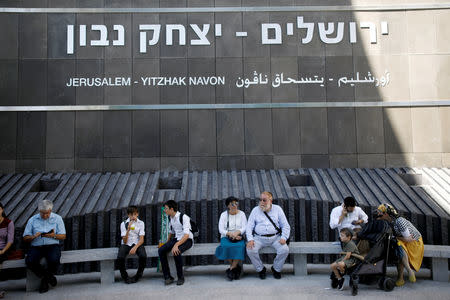 People sit outside Israel's new high-speed rail line station in Jerusalem September 25, 2018. REUTERS/Amir Cohen