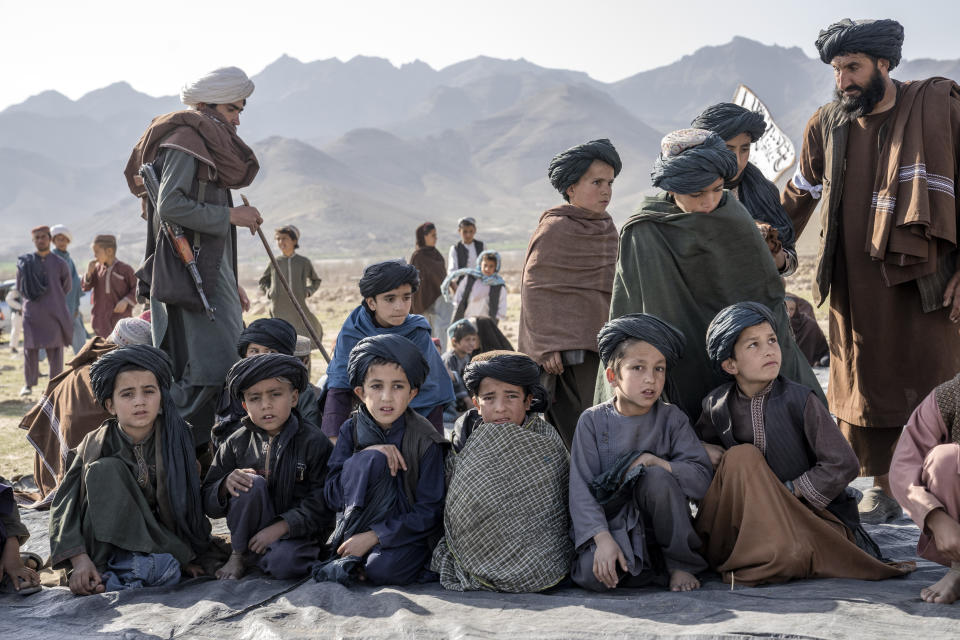 Children participate in celebrations for completing their religious studies in Afghanistan, on Saturday, Feb. 25, 2023. (AP Photo/Ebrahim Noroozi)
