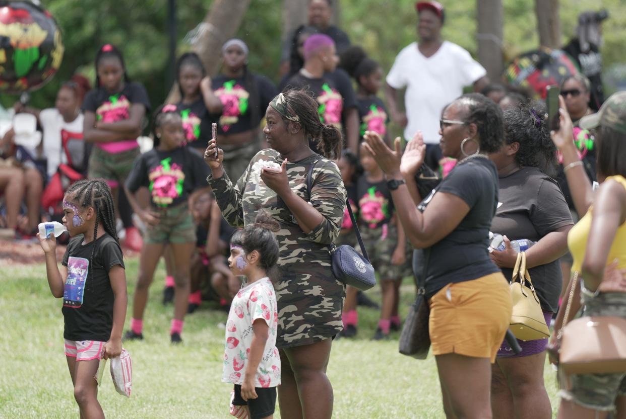 People gather for the Juneteenth Festival held at Sara Sims Park. The family friendly event featured food trucks, music, children’s activities such as bounce houses, face painting and games on Monday, June 19, 2023 in Boynton Beach.