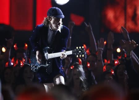 Angus Young of AC/DC performs a medley of songs to open the show at the 57th annual Grammy Awards in Los Angeles, California February 8, 2015. REUTERS/Lucy Nicholson