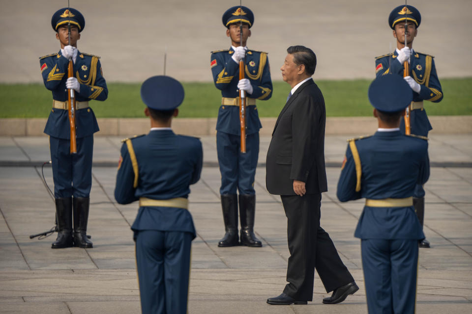 Chinese President Xi Jinping walks past an honor guard during a ceremony to mark Martyr's Day at the Monument to the People's Heroes at Tiananmen Square in Beijing, Friday, Sept. 30, 2022. (AP Photo/Mark Schiefelbein)