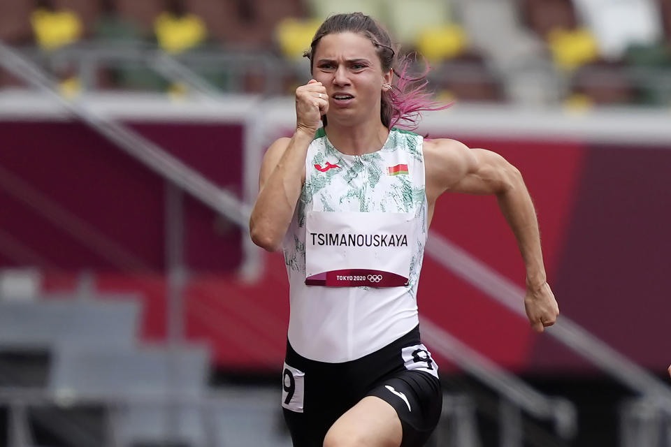 FILE - In this Friday, July 30, 2021 file photo, Krystsina Tsimanouskaya, of Belarus, runs in the women's 100-meter run at the 2020 Summer Olympics, Japan. Tsimanouskaya fled to Poland this week, saying she feared reprisals from Belarus' authoritarian government back home after a dispute with her coaches at the Tokyo Games. (AP Photo/Martin Meissner, File)
