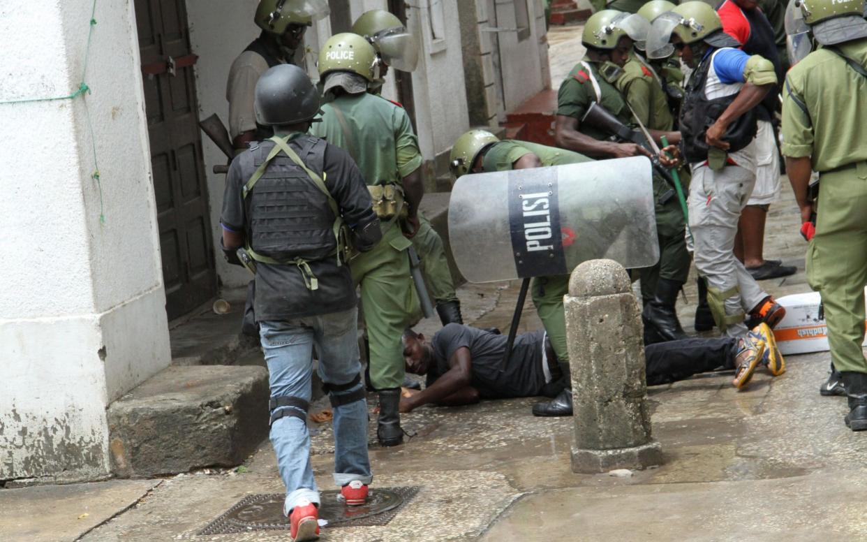 Police officers arrest a man during ongoing security operations prior to Tanzania's general elections, in Stone Town, Zanzibar, Tanzania, 27 October 2020 - ANTHONY SIAME/EPA-EFE/Shutterstock /EPA