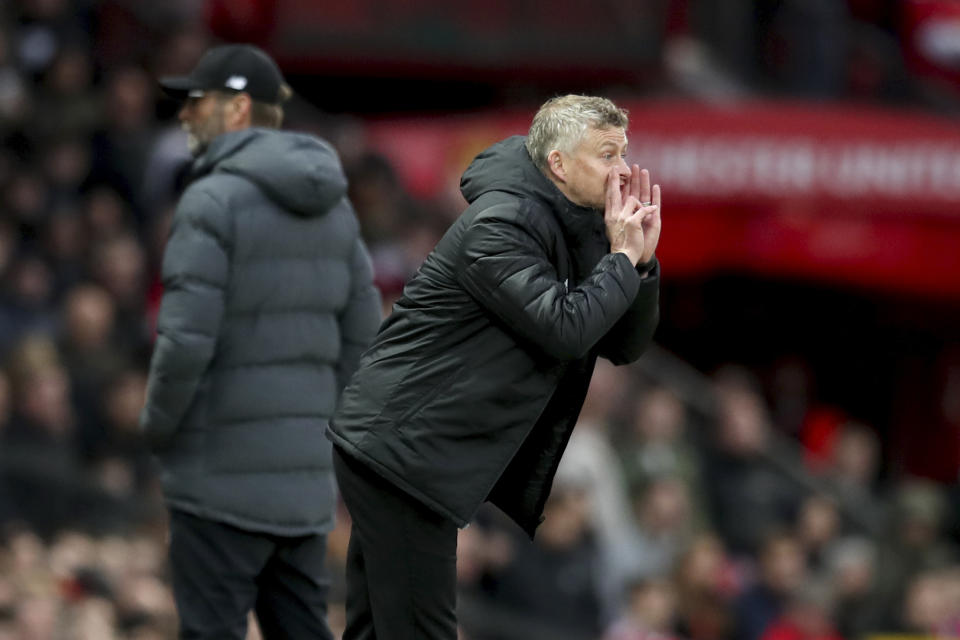 Manchester United's manager Ole Gunnar Solskjaer yells during the English Premier League soccer match between Manchester United and Liverpool at the Old Trafford stadium in Manchester, England, Sunday, Oct. 20, 2019. (AP Photo/Jon Super)