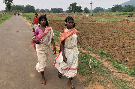 Members of the Dongria Kondh tribe leave after attending a protest rally demanding the ouster of a Vedanta Limited alumina plant in Lanjigarh in the eastern state of Odisha, India, June 5, 2018. REUTERS/Krishna N. Das