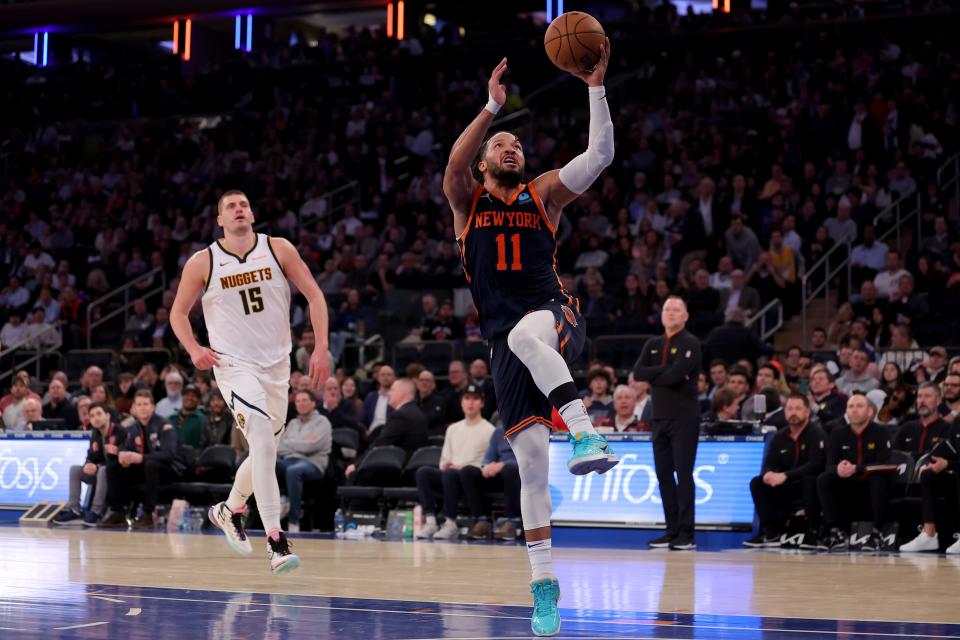 Jan 25, 2024; New York, New York, USA; New York Knicks guard Jalen Brunson (11) drives to the basket against Denver Nuggets center Nikola Jokic (15) during the third quarter at Madison Square Garden. Mandatory Credit: Brad Penner-USA TODAY Sports