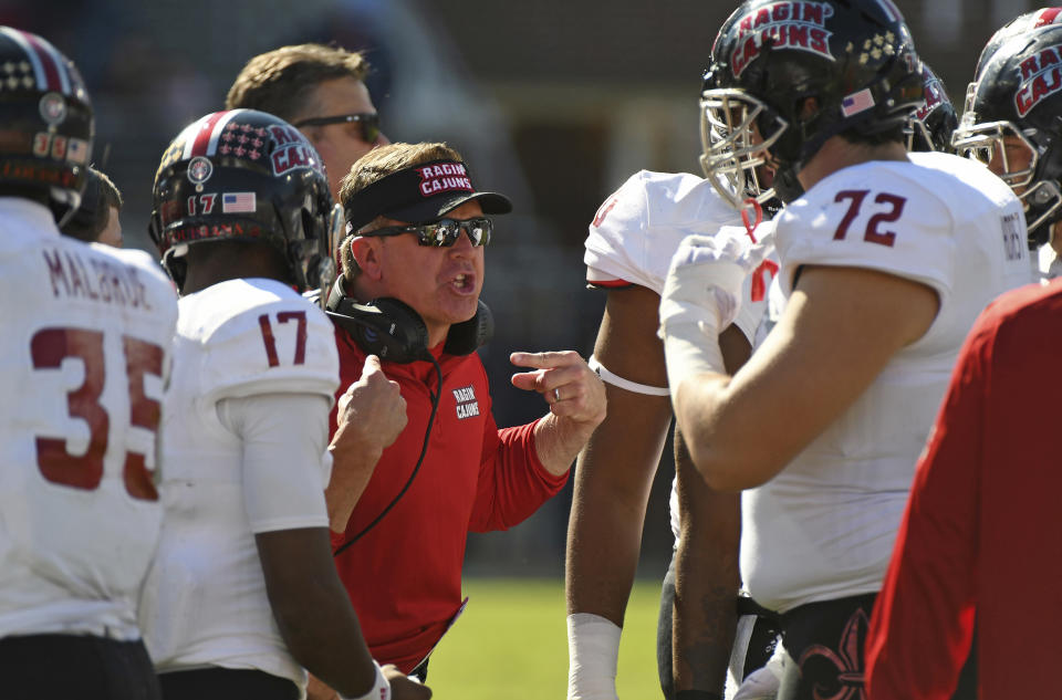 Louisiana-Lafayette head coach Mark Hudspeth talks to players during the first half of an NCAA college football game against Mississippi in Oxford, Miss., Saturday, Nov. 11, 2017. (AP Photo/Thomas Graning)