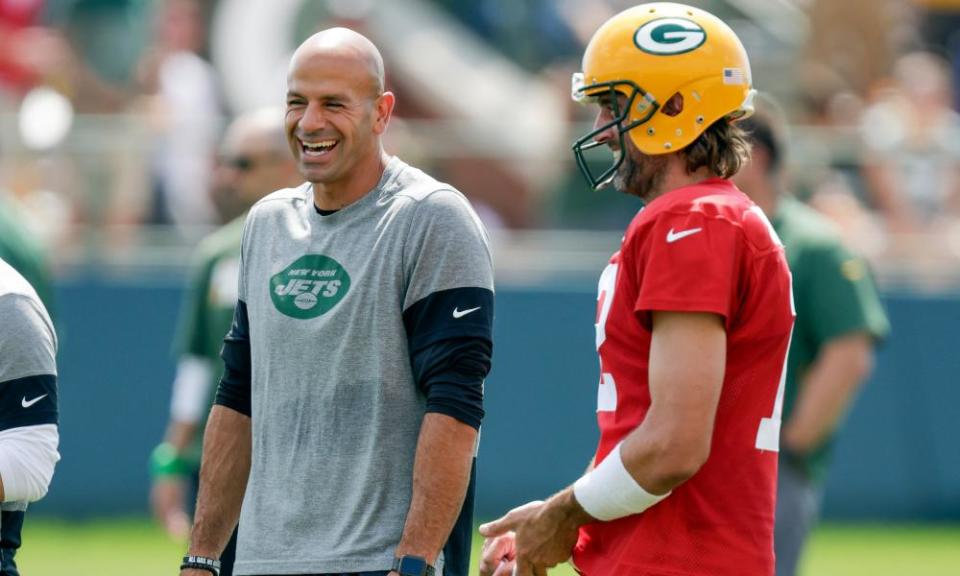 New York Jets head coach Robert Saleh laughs with Aaron Rodgers during a joint training camp in 2021