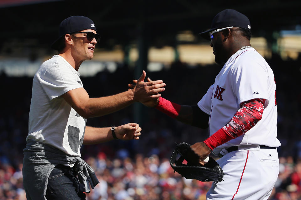 BOSTON, MA - APRIL 13:  New England Patriots quarterback Tom Brady talks with David Ortiz #34 of the Boston Red Sox after throwing out the first pitch before the game against the Washington Nationals at Fenway Park on April 13, 2015 in Boston, Massachusetts.  (Photo by Maddie Meyer/Getty Images)