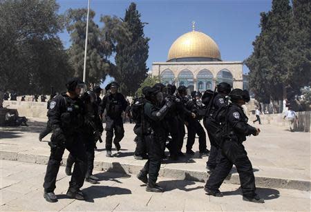 Israeli policemen react during clashes with Palestinians on the compound known to Muslims as the Noble Sanctuary and to Jews as the Temple Mount in Jerusalem's Old City September 6, 2013. REUTERS/Ammar Awad