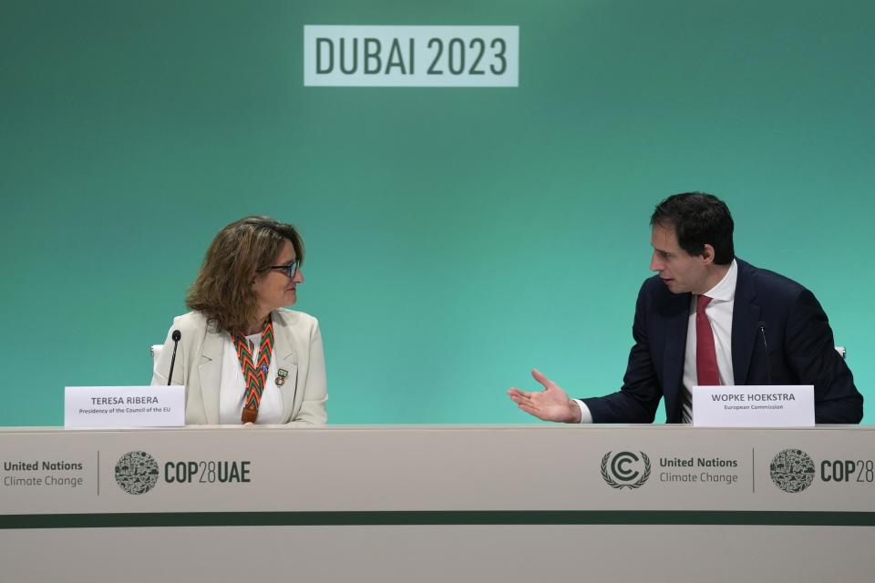 Spain's Minister for Ecological Transition Teresa Ribera, left, and European Union Commissioner Wopke Hoekstra speak during a news conference at the COP28 U.N. Climate Summit, Wednesday, Dec. 6, 2023, in Dubai, United Arab Emirates. (AP Photo/Kamran Jebreili)
