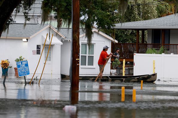 TARPON SPRINGS, FLORIDA - AUGUST 30: A person canoes through the flooded streets caused by Hurricane Idalia passing offshore on August 30, 2023 in Tarpon Springs, Florida. Hurricane Idalia is hitting the Big Bend area on the Gulf Coast of Florida.  (Photo by Joe Raedle/Getty Images)