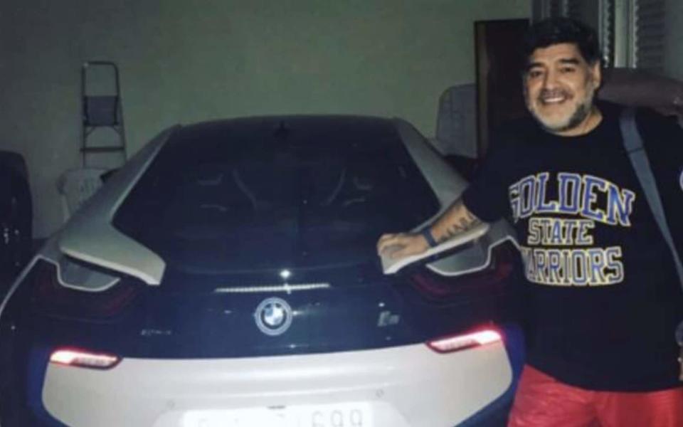 Maradona with one of his cars