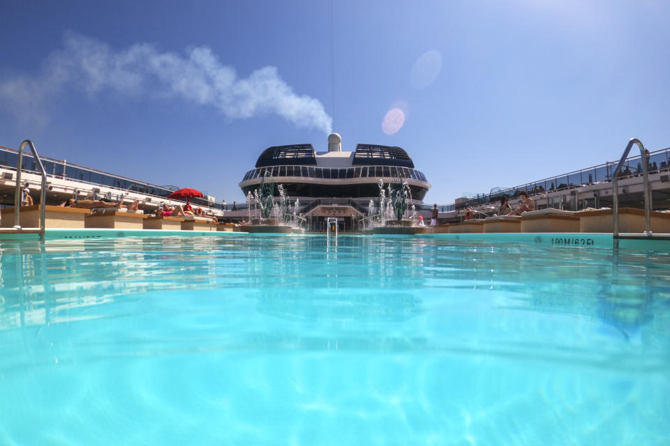 Passengers enjoy the sun by a swimming pool on board the MSC Grandiosa cruise ship in Civitavecchia, near Rome, Wednesday, March 31, 2021. MSC Grandiosa, the world's only cruise ship to be operating at the moment, left from Genoa on March 30 and stopped in Civitavecchia near Rome to pick up more passengers and then sail toward Naples, Cagliari, and Malta to be back in Genoa on April 6. For most of the winter, the MSC Grandiosa has been a lonely flag-bearer of the global cruise industry stalled by the pandemic, plying the Mediterranean Sea with seven-night cruises along Italy’s western coast, its major islands and a stop in Malta. (AP Photo/Andrew Medichini)