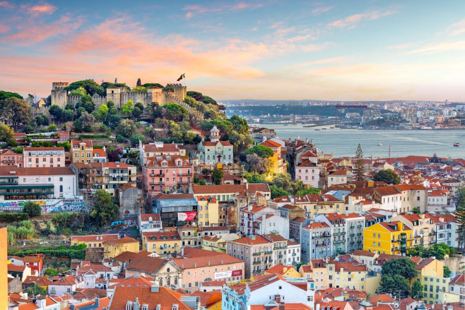 Sao Jorge Castle overlooks the Portuguese capital city of Lisbon. Flights from the East Coast to Lisbon are plentiful and affordable.