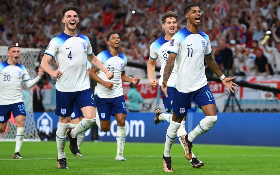 Marcus Rashford of England celebrates after scoring their team's first goal during the FIFA World Cup Qatar 2022 Group B match between Wales and England at Ahmad Bin Ali Stadium on November 29, 2022 in Doha, Qatar - Shaun Botterill - FIFA/FIFA via Getty Images