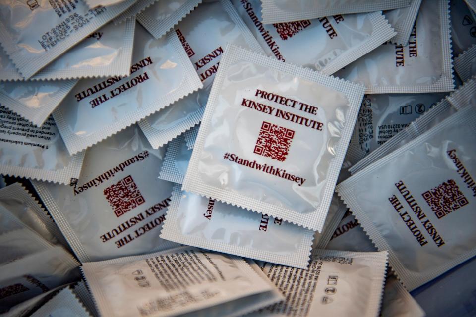 Kinsey Institute supporters handed out free condoms on campus last week. A QR code on the packaging opens a letter to Indiana University President Pamela Whitten that people can sign to show their support for the institute.