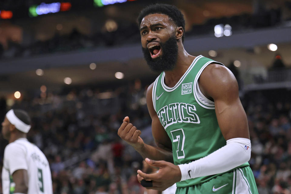Boston Celtics guard Jaylen Brown (7) reacts to a foul call during the second half of the team's NBA basketball game against the Milwaukee Bucks on Saturday, Dec. 25, 2021, in Milwaukee. The Bucks won 117-113. (AP Photo/Jon Durr)