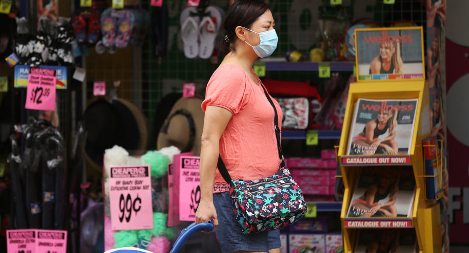 Woman in Sydney wearing face mask amid coronavirus outbreak.