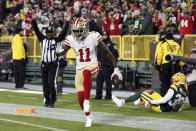 San Francisco 49ers wide receiver Marquise Goodwin (11) celebrates a touchdown during the first half of an NFL football game against the Green Bay Packers Monday, Oct. 15, 2018, in Green Bay, Wis. (AP Photo/Matt Ludtke)