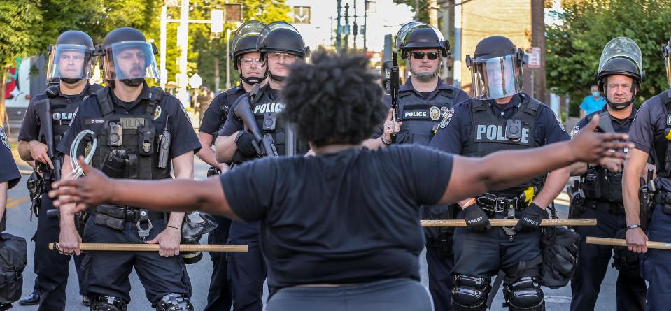 A crowd gathered on Bardstown Road in Louisville, Ky., on May 30, 2020, to protest the killing of Breonna Taylor. Police in riot gear blocked them from moving further south.