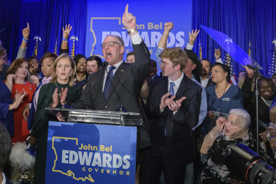 Louisiana Gov. John Bel Edwards arrives to address supporters at his election night watch party in Baton Rouge, La., Saturday, Nov. 16, 2019. (AP Photo/Matthew Hinton)