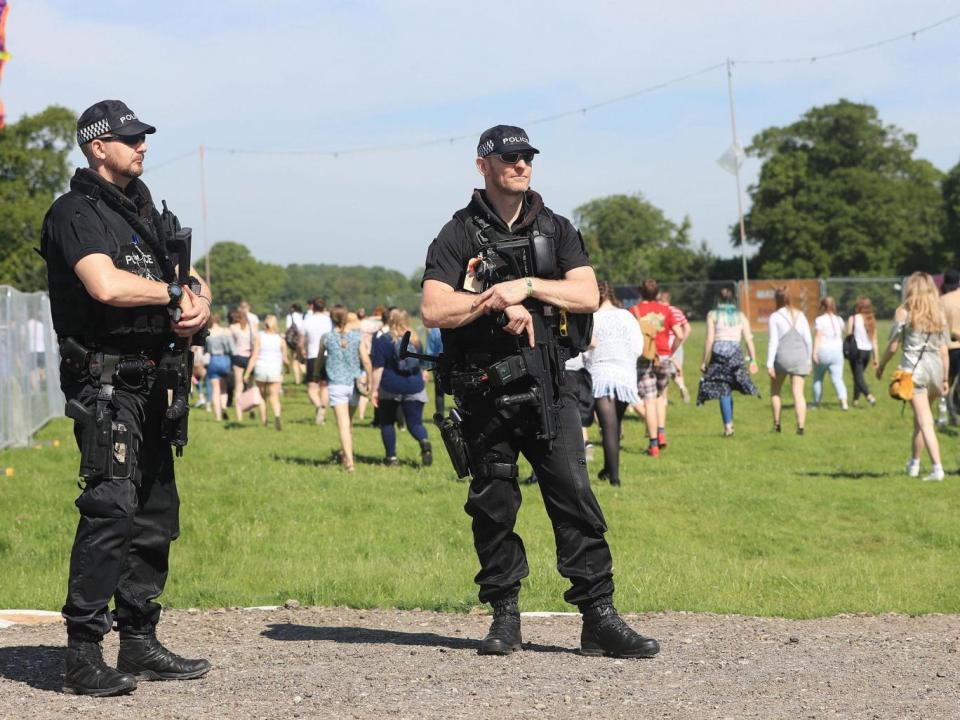 Armed police officers patrol outside Burton Constable Hall in Hull on Saturday ahead of BBC Radio 1's Big Weekend (PA)