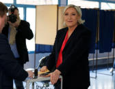 Marine Le Pen, French National Front (FN) political party candidate for French 2017 presidential election, casts her ballot in the second round of 2017 French presidential election at a polling station in Henin-Beaumont, France, May 7, 2017. REUTERS/Pascal Rossignol