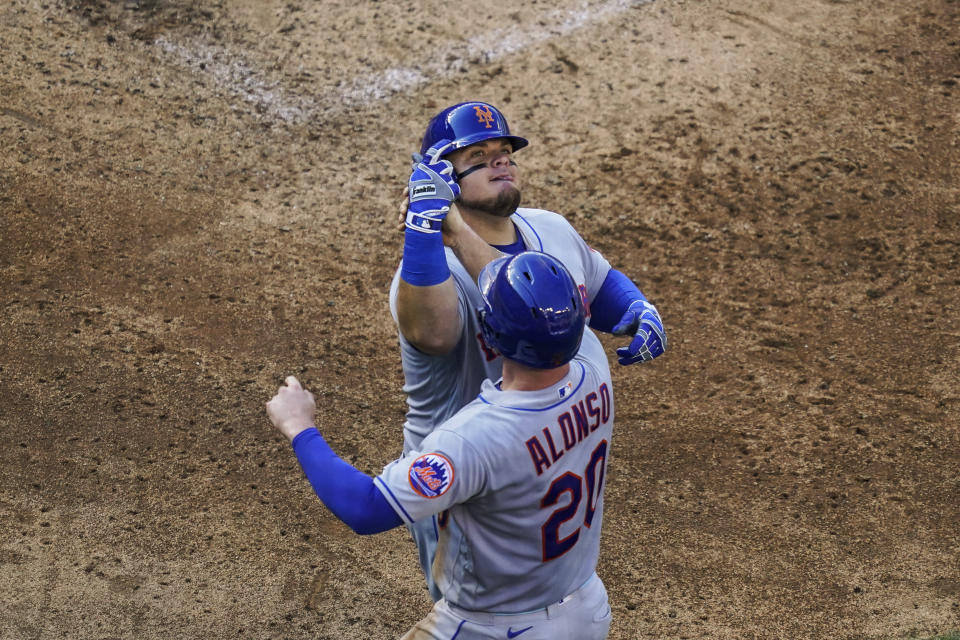 New York Mets' Daniel Vogelbach, celebrates his grand slam with Pete Alonso during the fifth inning of the team's baseball game against the Washington Nationals at Nationals Park, Wednesday, Aug. 3, 2022, in Washington. (AP Photo/Alex Brandon)