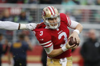 <p>San Francisco 49ers quarterback C.J. Beathard has his jersey pulled as he tries to throw against the Seattle Seahawks during the first half of an NFL football game Sunday, Nov. 26, 2017, in Santa Clara, Calif. (AP Photo/John Hefti) </p>