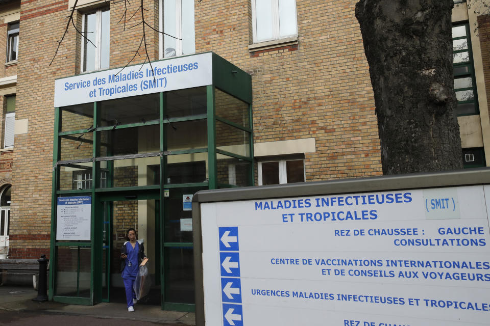 A medical staff leaves the department of Tropical Infections and diseases at the Bichat hospital, Wednesday, Jan. 29, 2020 in Paris. Countries began evacuating their citizens Wednesday from the Chinese city hardest-hit by a new virus that has now infected more people in China than were sickened in the country by SARS. France has reported four cases of the deadly new virus so far. (AP Photo/Christophe Ena)