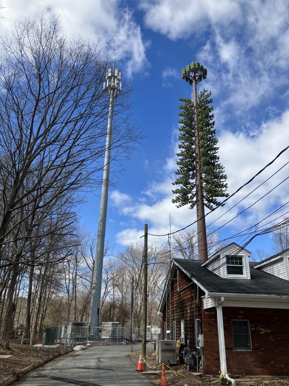 Temporary (left) and permanent (right) cell towers at Fire Company 3 in Mahwah.