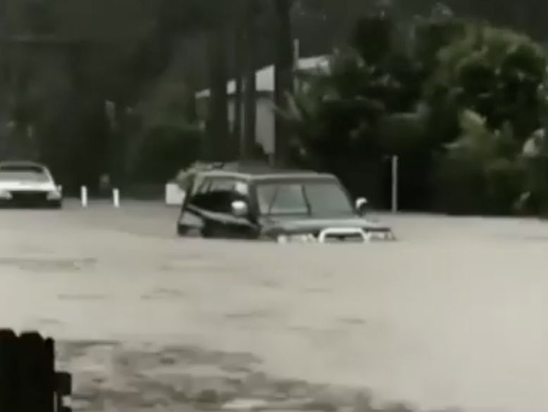 A car in flood waters on the NSW South Coast.