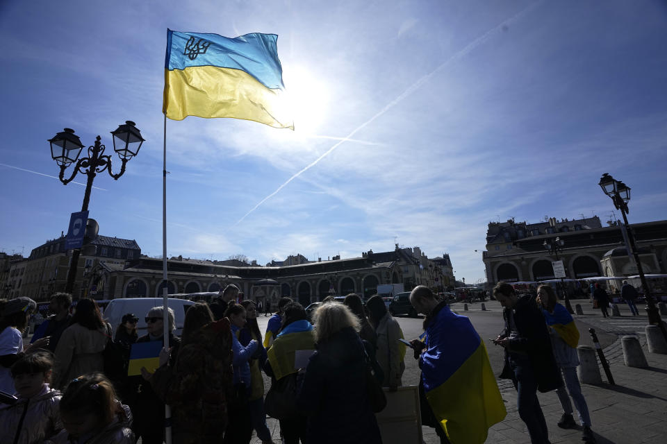 A group of Ukrainian protesters demonstrate near the Chateau de Versailles, where a European Union summit will take place, Thursday, March 10, 2022 in Versailles, west of Paris. With European nations united in backing Ukraine's resistance with unprecedented economic sanctions, three main topics now dominate the agenda: Ukraine's application for fast-track EU membership; how to wean the bloc off its Russian energy dependency; and bolstering the region's defense capabilities. (AP Photo/Michel Euler)