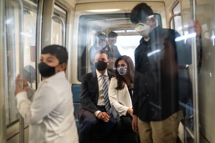 Sen. Alex Padilla rides the Senate subway with his wife, Angela, and sons Diego, left, and Roman.