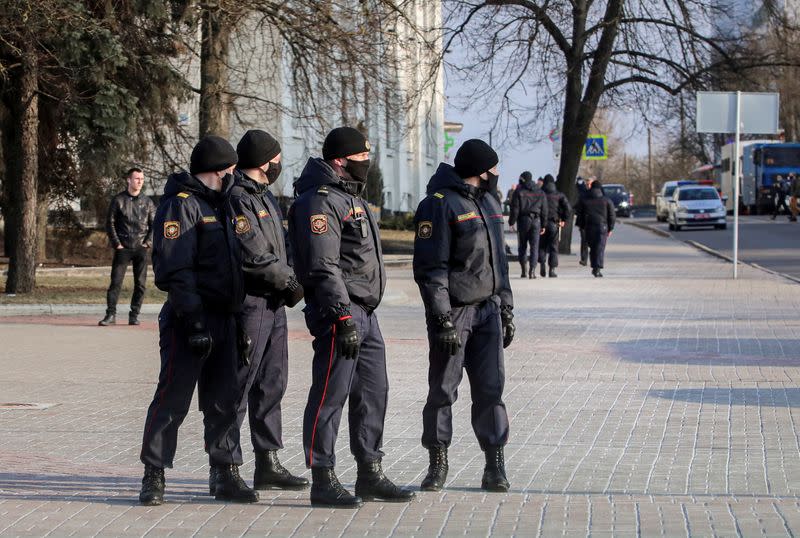 FILE PHOTO: Belarusian law enforcement officers stand guard in a street in Minsk