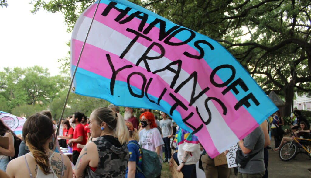 people gathered at Washington Square Park in New Orleans on March 31, 2023, for a march to mark Transgender Day of Visibility