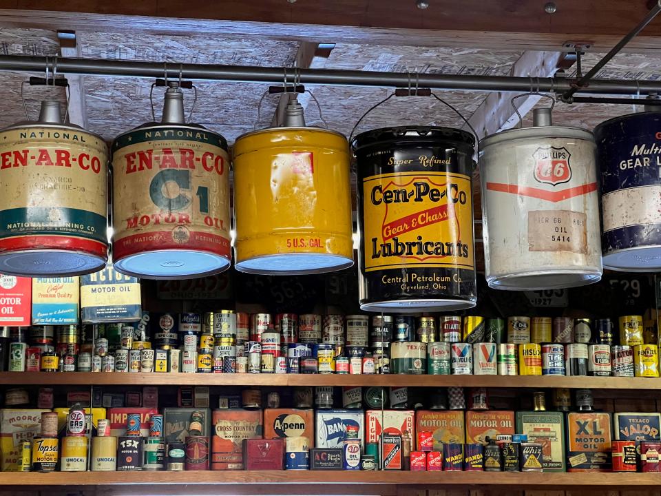 Antique oil and gas cans decorate Chuck Bowman's garage.