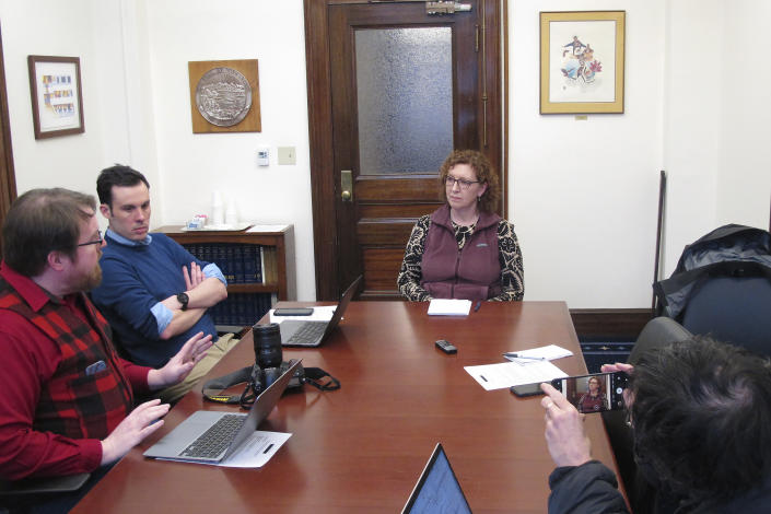 Carol Beecher, center, the new director of Alaska's Division of Elections, listens to a questions during a news conference on Thursday, Feb. 16, 2023, in Juneau, Alaska. Beecher's appointment as director was announced Wednesday Feb. 15, 2023, by Lt. Gov. Nancy Dahlstrom, who participated in Thursday's news conference by phone. (AP Photo/Becky Bohrer)